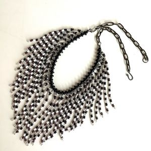 Beaded fringed waterfall necklace in black, white and silver with onyx stones.